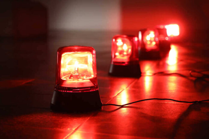 shutterstock_1042134532.jpg featured image Red emergency lights on dark floor, illuminating the area.