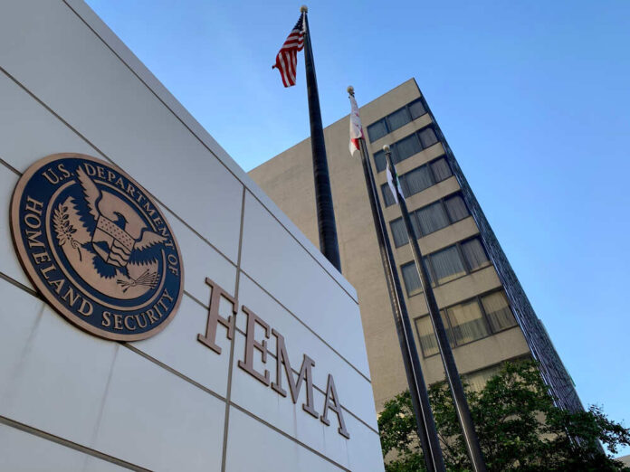shutterstock_1819068767.jpg featured image FEMA building with flags and Homeland Security seal.