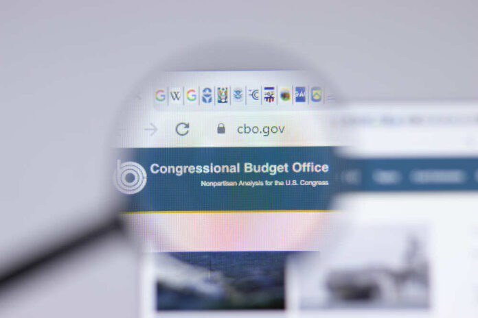 shutterstock_1963575202.jpg featured image Magnifying glass over Congressional Budget Office website