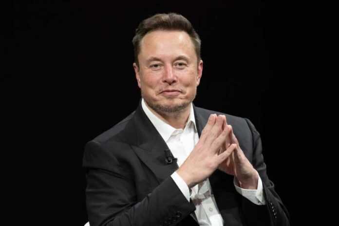 shutterstock_2318800323.jpg featured image Elon Musk in a suit talking.