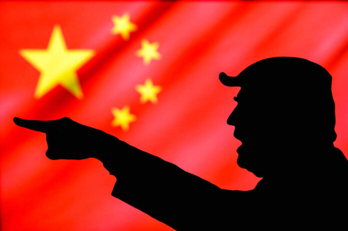 shutterstock_1743988967.jpg featured image Silhouette pointing with Chinese flag background