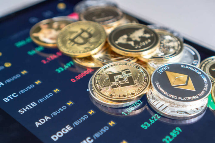 shutterstock_2002007354.jpg featured image Cryptocurrency coins on digital trading screen