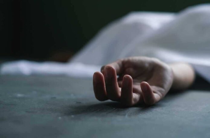 shutterstock_2193737127.jpg featured image Close-up of a hand under a white sheet.