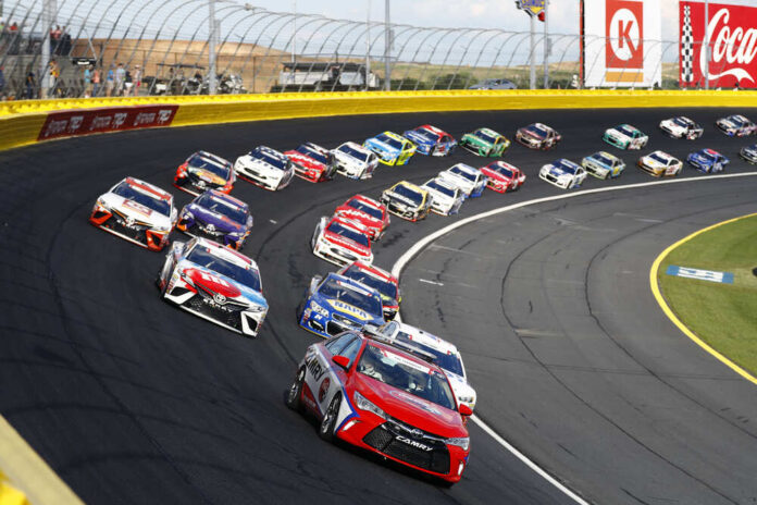 shutterstock_651212332.jpg featured image Race cars on a track in formation driving fast