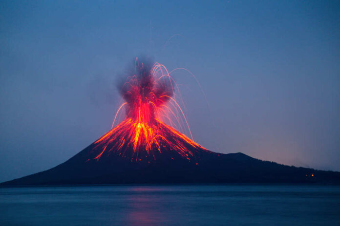 Volcano erupting with bright lava and smoke display