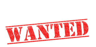 Red WANTED stamp on white background