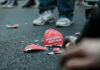 Shattered Make America Great Again hat on the ground