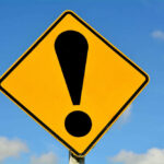 Yellow caution sign with exclamation mark symbol