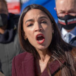 Alexandria Ocasio-Cortez speaking at an event.