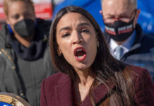 Alexandria Ocasio-Cortez speaking at an event.