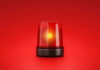 Red emergency light on red background
