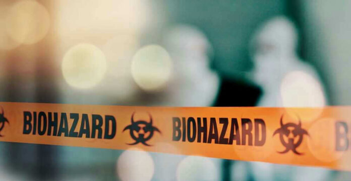 Biohazard tape with blurred figures in background