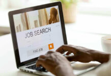 Person searching for jobs on a laptop
