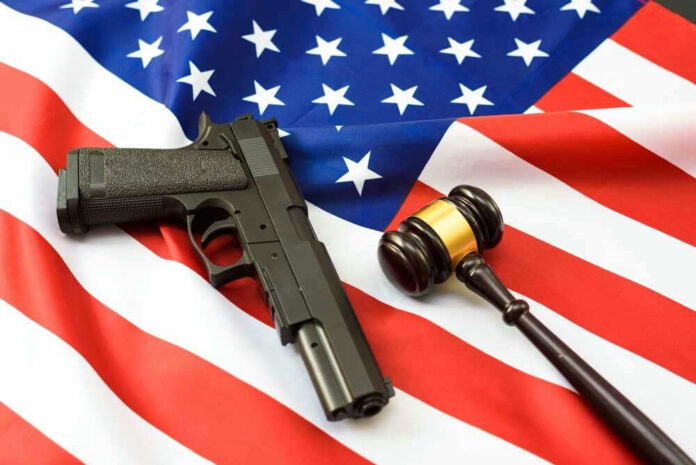 Gun and gavel on a US flag