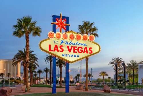 Welcome sign to Fabulous Las Vegas with palm trees in the background