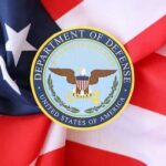 Department of Defense emblem on an American flag