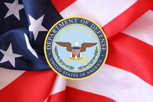 Department of Defense emblem on an American flag