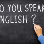 Chalkboard with the question Do you speak English written in white chalk