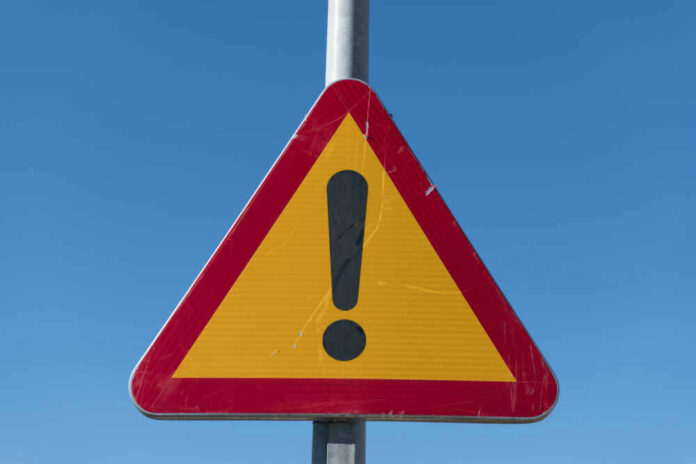 Triangular warning sign with exclamation mark