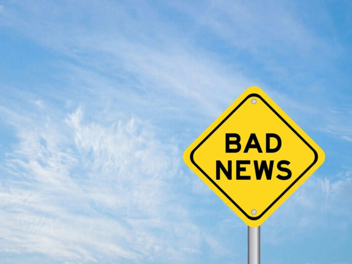 Yellow sign reads bad news in sky
