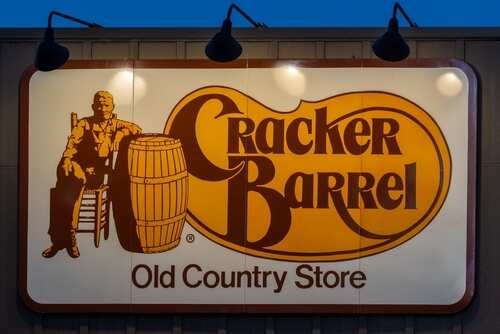 Cracker Barrel restaurant sign featuring a seated figure and a barrel