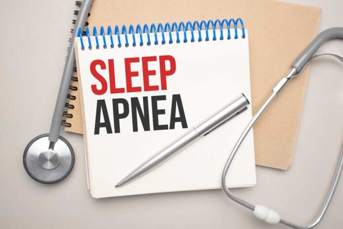Notebook with the words 'SLEEP APNEA' written on it, accompanied by a pen and a stethoscope
