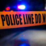 Church Parking Lot MASSACRE — Two Dead, Six Critical Police tape with flashing lights in the background.