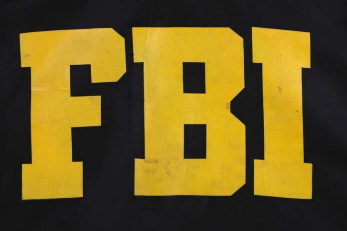FBI logo displayed in large yellow letters on a black background