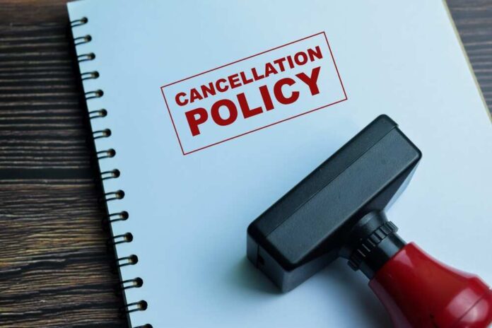 Rubber stamp on a notebook with the text 'CANCELLATION POLICY'