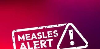 Measles alert warning sign with exclamation mark