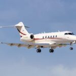 Jet UPSIDE DOWN After Risky Storm Takeoff A private jet descending towards the runway against a blue sky