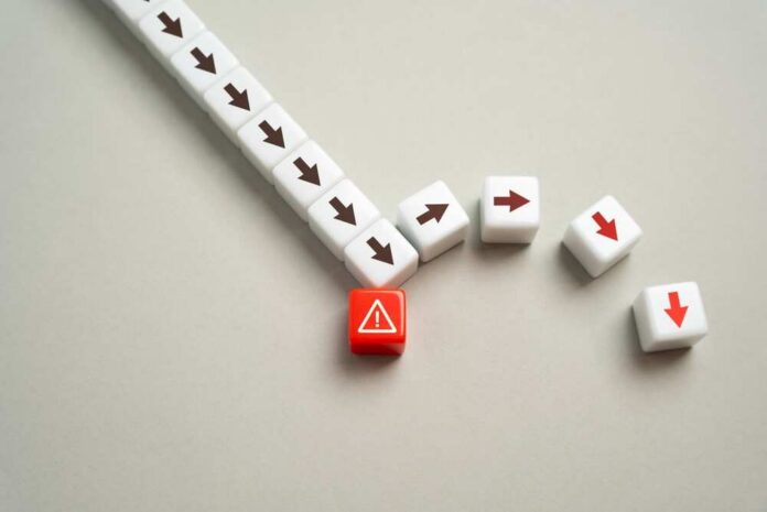 A red warning block surrounded by white blocks with directional arrows