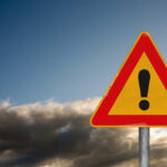 What Vonn Did One Week Before CHANGES EVERYTHING A triangular warning sign with an exclamation mark against a cloudy sky