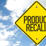 Beloved Cookie Brand Hit With Massive RECALL Yellow product recall sign against cloudy sky