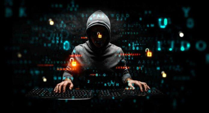 Hacker wearing a hoodie with digital codes overlaying.