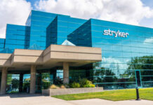 Exterior view of the Stryker Corporation building with a glass facade