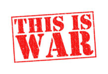 A bold red stamp with the text 'THIS IS WAR'