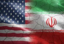 Flags of the United States and Iran blended together with a cracked texture