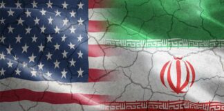 Flags of the United States and Iran blended together with a cracked texture
