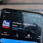 Smartphone displaying the Fox News app with ratings and download information