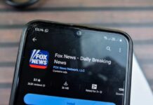 Smartphone displaying the Fox News app with ratings and download information