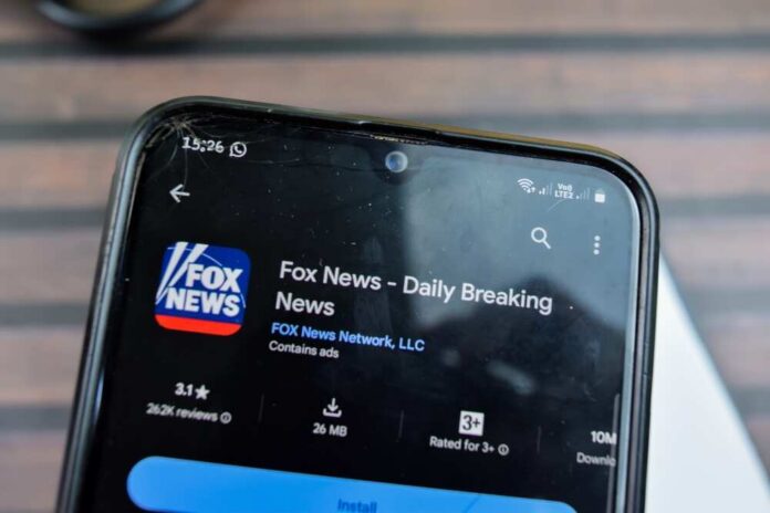 Smartphone displaying the Fox News app with ratings and download information