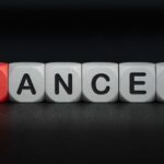 Blocks spelling the word 'CANCER' with one block in red