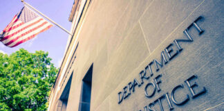 Department of Justice building with American flag.