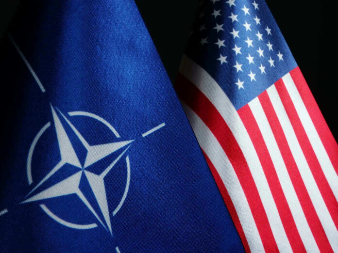 NATO flag and United States flag side by side.