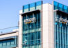 Exterior view of an Amazon corporate building with a glass facade
