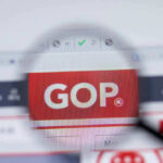 Magnifying glass highlighting GOP on a computer screen.