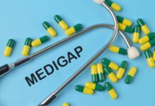 A stethoscope placed on a blue background with green and yellow capsules and the word 'Medigap'