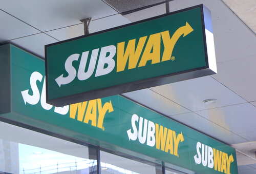 shutterstock_221250049 (1).jpg Subway restaurant sign displayed prominently