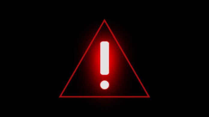 shutterstock_2223990955.jpg Red triangular warning sign with an exclamation mark